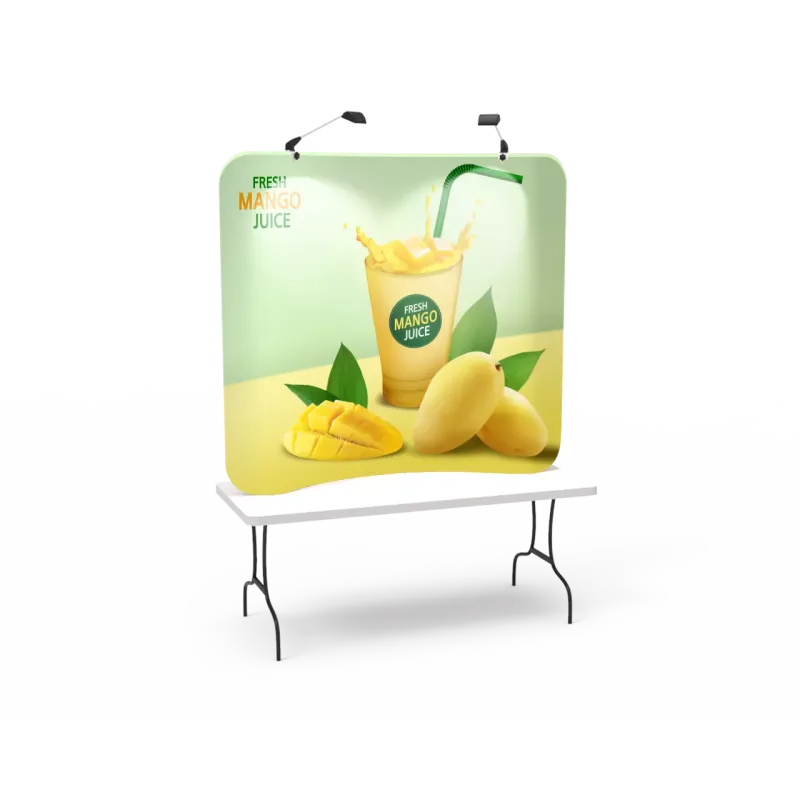 6ft curved tabletop tension fabric display on standard 6ft trade show table, front view with custom printed graphic and clip on lights